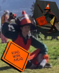 Collage of Valiant wearing a hat that looks like a traffic cone and carrying a shield that looks like a "Road Work Ahead" sign.